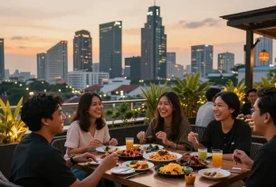 Group of friends enjoying a vibrant rooftop dinner in Jakarta, featuring local dishes and a stunning sunset.